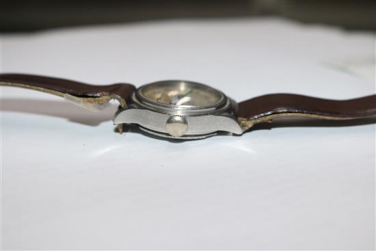 A mid 20th century stainless steel Longines mid size? manual wind wrist watch retailed by J.W. Benson,